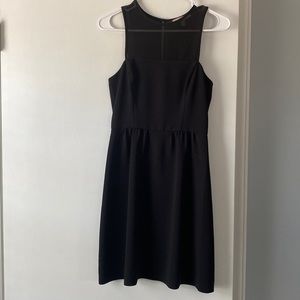 Little black dress with sheer neckline